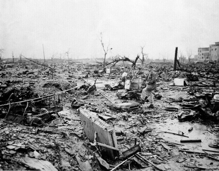 About one month after the dropping of the first atomic bomb on Aug. 6, 1945, an allied correspondent examines the landscape of destruction at Hiroshima, Japan. (AP Photo)