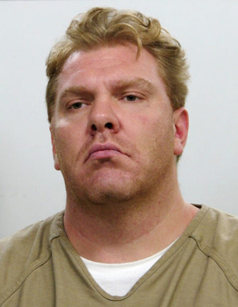 Jail inmate charged with trying to hire hit man