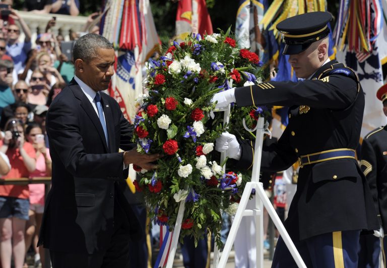 President Obama lays a wreath at the Tomb of the Unknowns at Arlington National Cemetery in Arlington, Va., Monday. President Obama is leading the nation in remembering its war heroes, the fallen and those still defending the flag, in a Memorial Day tribute. (AP Photo/Susan Walsh)