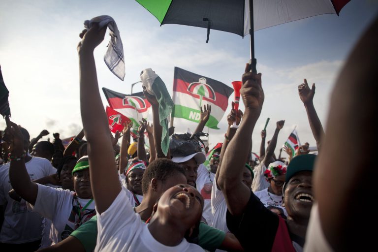   Ruling party supporters react during Ghanian President John Dramani Mahama's final campaign rally ahead of Friday's presidential election, in Accra, Ghana, Wednesday, Dec. 5, 2012. After five coups and decades of stagnation, the West African nation of 25 million is now a pacesetter for the continent's efforts to become democratic. Ghanaians will go to the polls on Friday to choose between four candidates, including Mahama, a former vice president who assumed the top post in July after the death of president John Atta Mills, and former foreign minister Nana Akufo-Addo who lost the presidency by less than 1 percent in 2008.(AP Photo/Gabriela Barnuevo)  