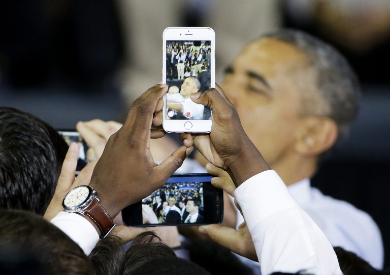 Members of the crowd take photos on their cellphones of President Barack Obamaas he leaves after speaking at Georgia Tech inÂ March 10. Online photo and news sharing services such as Snapchat and Instagram are the new campaign tool to reach millennials.Â (AP Photo/David Goldman)