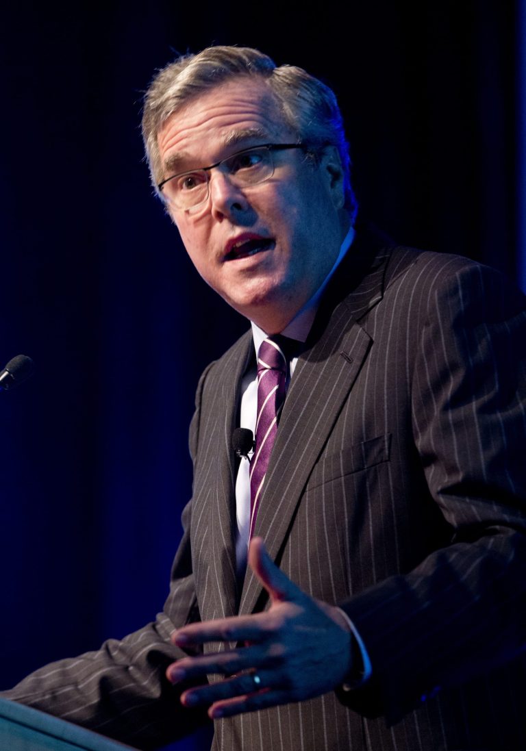 FILE- In this Jan. 29, 2014 file photo, former Florida Gov. Jeb Bush gestures as he speaks at a conference in Hollywood, Fla. Bush is tending to his growing business empire while other Republicans mulling the 2016 presidential race are laying the foundations of their potential campaigns.  (AP Photo/Wilfredo Lee, File)