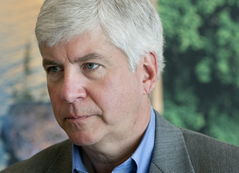 Michigan Gov. Rick Snyder speaks to the media during the Governor's Economic Summit at DeVos Place in Grand Rapids, Mich., Tuesday, March 18, 2014. Snyder announced Tuesday that Michigan will be one of three states chosen to participate in the Hiring our Heroes program's All Vet States program, a new initiative intended to help military veterans find jobs. (AP Photo/The Grand Rapids Press, Cory Morse) ALL LOCAL TV OUT; LOCAL TV INTERNET OUT