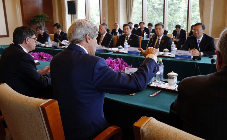U.S. Secretary of State John Kerry, center, and Treasury Secretary Jack Lew, left, participate in a joint session on Climate Change and Clean Energy with China's Minister of Finance Lou Jiwei, third right, China's Vice Premier Wang Yang, second right, and State Councilor Yang Jiechi, right, at the Diaoyutai State Guesthouse in Beijing,China Wednesday, July 9, 2014. (AP Photo/Jim Bourg, Pool)