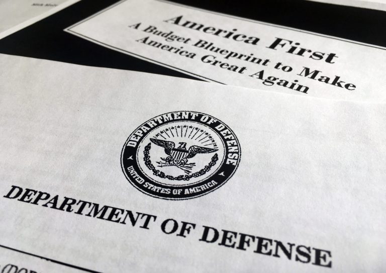 President Trump is unveiling a $1.15 trillion budget, a far-reaching overhaul of federal government spending that slashes a dozen departments to finance a significant increase in the military. (AP Photo/Jon Elswick)
