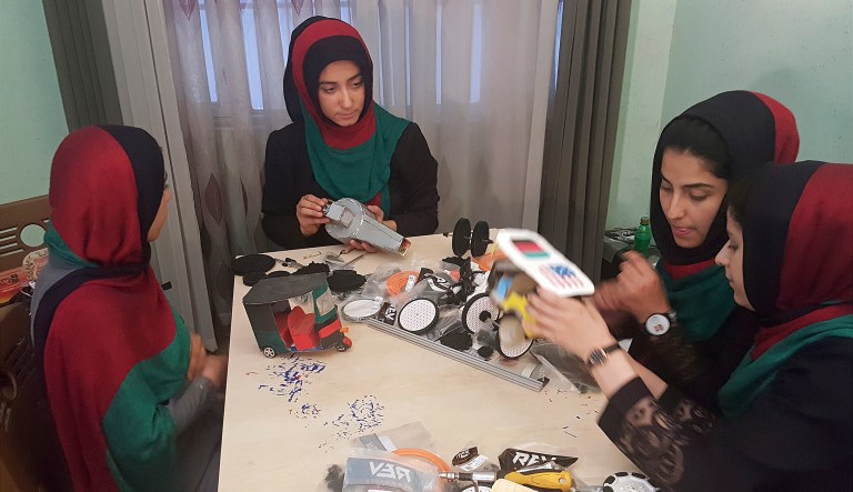 The girls were on their way to an international robotics competition. (AP Photos/Ahmad Seir)