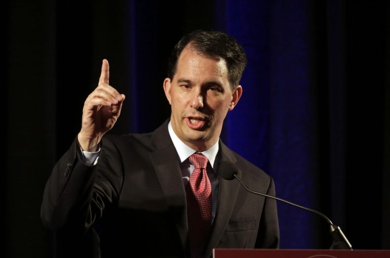 Wisconsin Gov. Scott Walker delivers comments during the North Carolina Republican Party convention in Raleigh, N.C., Friday, June 5, 2015. (AP Photo/Gerry Broome)