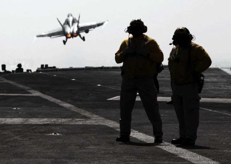 In this photo taken Thursday, Jan. 30, 2014, a U.S. Navy F-18 flies off the deck of the USS Harry S. Truman aircraft carrier in the Gulf of Oman for missions relating to Afghanistan. (AP Photo/Hasan Jamali)