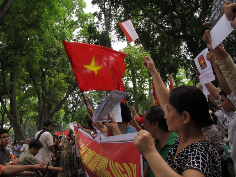 Vietnamese protesters stage a rally against Beijing's deployment of an oil rig in the contested waters of the South China Sea, outside the Chinese Embassy on Sunday, May 11, 2014 in Hanoi, Vietnam. The deployment of the rig has a triggered a tense standoff in the ocean and raised fears of confrontation between the neighboring  countries. (AP Photo/Chris Brummitt)