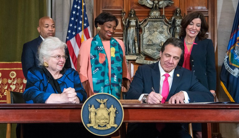 ADDS NAMES OF OTHERS WITH CUOMO - In this photo provided by the Office of Gov. Andrew M. Cuomo, Cuomo, right, signs Reproductive Health Act Legislation during a ceremony, Tuesday, Jan. 22, 2019, in the Red Room at the State Capitol in Albany, N.Y. With the new law, New York state enacts one of the nation's strongest protections for abortion rights, a move that state leaders say was needed to safeguard those rights should the U.S. Supreme Court overturn Roe v. Wade. Also pictured are attorney Sarah Weddington, front left, who successfully argued Roe v Wade before the Supreme Court; New York State assembly Speaker Carl Heastie, back left; New York State Senate Leader Andrea Stewart-Cousins, D-Yonkers, standing center; and Democratic Lt. Gov Kathy Hochul, back right.