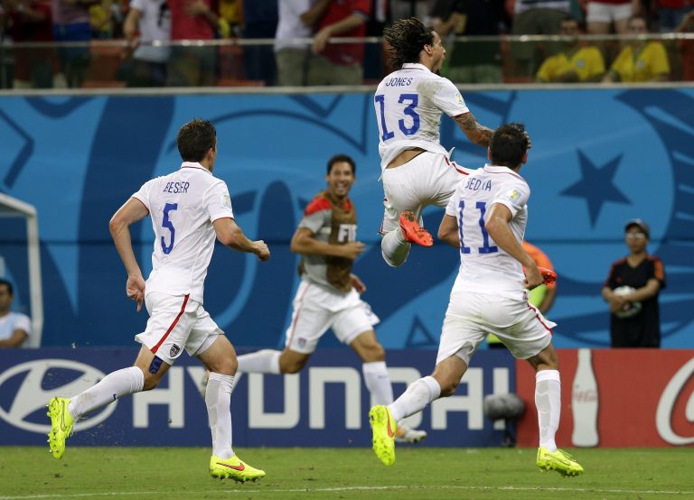 United States' Jermaine Jones (13) celebrates after scoring his side's first goal during the group G World Cup soccer match between the United States and Portugal at the Arena da Amazonia in Manaus, Brazil, Sunday, June 22, 2014. (AP Photo/Martin Mejia)