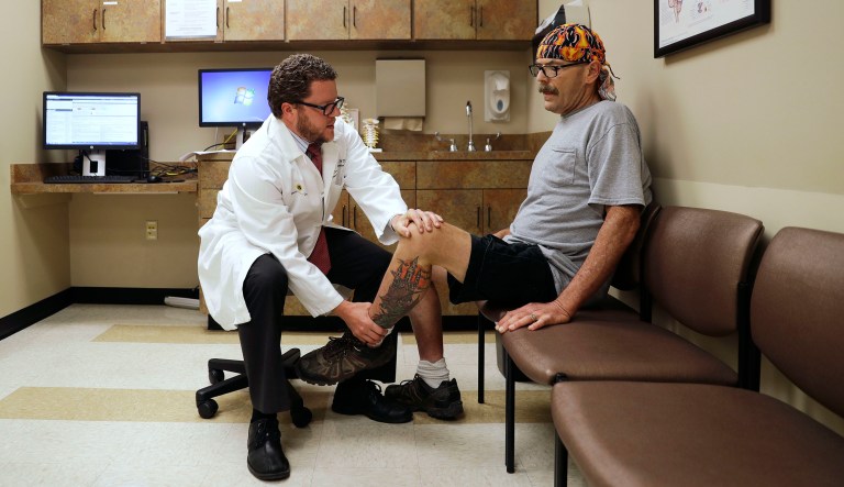Dr. Dan Lonergan, a pain specialist who also focuses on addiction, left, treats patient Jeff McCoy at his practice in Franklin, Tenn., Monday, June 5, 2017. According to the Center for Disease Control and Prevention, life expectancy in America fell in 2016, with the rise of heart disease and drug-related overdoses being key factors in the uptick in deaths. (AP Photo/David Goldman)