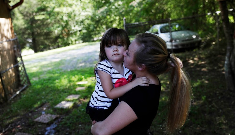 Whitney Duncan holds her daughter, Deklyn, 3, while visiting her at the home she's staying at with her grandmother in Jasper, Ga., Monday, June 26, 2017.