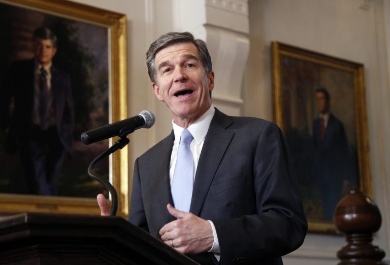 Cooper acknowledges that it's not a perfect deal and stops short of many things the state needs to do. (Chris Seward/The News & Observer via AP)