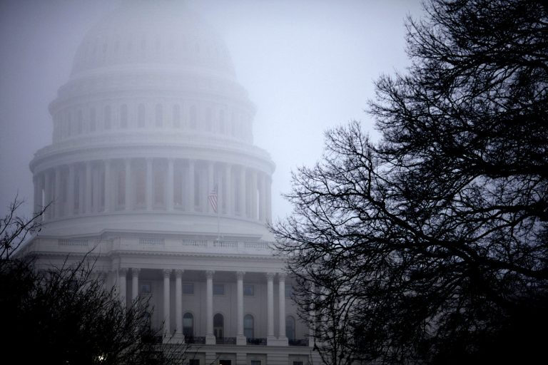   FILE - In this Monday, Dec. 10, 2012, file photo, fog obscures the Capitol dome on Capitol Hill in Washington. Even if Congress and the White House fail to strike a budget deal by New Year's Day, reality may be a lot less bleak then the scenario that's been spooking employers and investors and slowing the U.S. Economy. The tax increases and spending cuts could be retroactively repealed after Jan. (AP Photo/J. Scott Applewhite, File)  