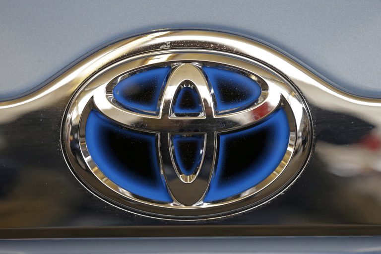 FILE - This Feb. 14, 2013 file photo shows the Toyota logo on the trunk of a Toyota automobile at the 2013 Pittsburgh Auto Show in Pittsburgh. Toyota executives on Thursday, Sept. 4, 2014 promised by 2017 to have collision-prevention technology installed across its U.S. line-up, in both mainstream and luxury vehicles. (AP Photo/Gene J. Puskar, File)