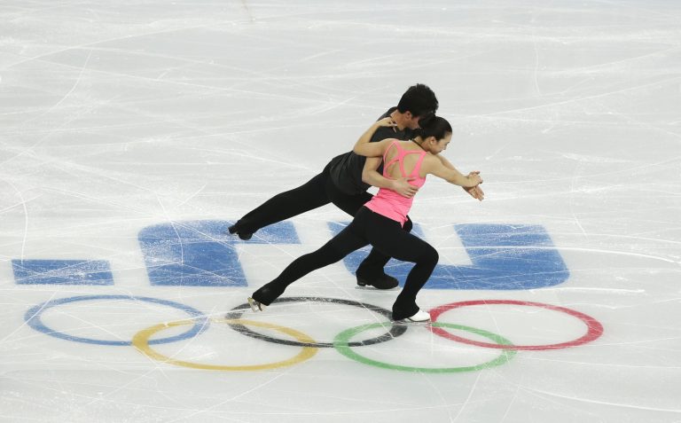 Huang Xintong and Zheng Xun of China perform during a figure skating practice session at the Iceberg Skating Palace ahead of the 2014 Winter Olympics, Monday, Feb. 3, 2014, in Sochi, Russia. (AP Photo/Mark Baker)