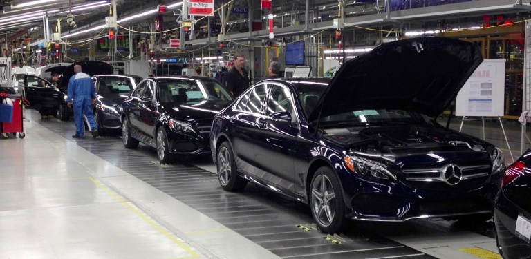 The redesigned Mercedes-Benz C-Class sedan reaches its final assembly stage at a plant in Vance, Ala. The luxury automaker has warned annual profit will drop in 2018 because of higher import tariffs. 