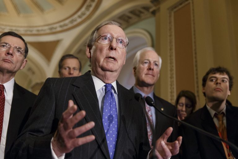 Senate Minority Leader Mitch McConnell of Ky., center, speaks to reporters on Capitol Hill in Washington, Tuesday, Feb. 25, 2014, following a closed-door Republican policy meeting.  McConnell says he sees no hope for enactment of tax overhaul legislation this year, and blames the Democrats for trying to use the issue to raise revenue by $1 trillion. The Kentucky Republican said the object of overhauling the tax code should be making the nation more competitive, not raising more money for the government. From left are,  Sen. John Barrasso, R-Wyo., Sen. John Thune, R-S.D., McConnell, and Senate Minority Whip John Cornyn of Texas. (AP Photo/J. Scott Applewhite)
