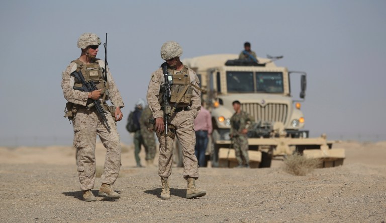 Task Force Southwest Marines walk during an Afghanistan's army training session in Shorab military camp in Helmand province, Afghanistan, Monday, Aug. 28, 2017.