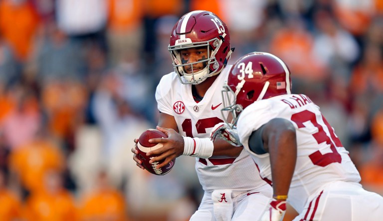 Alabama quarterback Tua Tagovailoa (13) turns to hand the ball off to running back Damien Harris (34) in the first half of an NCAA college football game against Tennessee Saturday, Oct. 20, 2018, in Knoxville, Tenn.