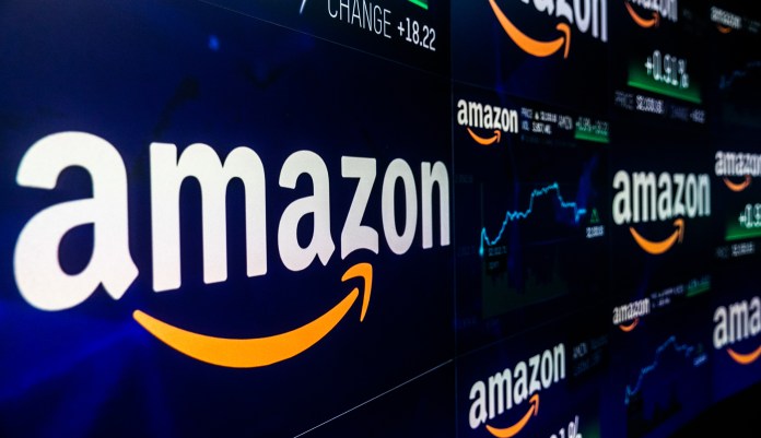 A monitor displays Amazon.com Inc. stock information at the Nasdaq MarketSite in New York, U.S., on Tuesday, Sep. 4, 2018. Amazon.com Inc.Â briefly became America's second trillion-dollar company on Tuesday after adding $434 billion to its market cap this year.