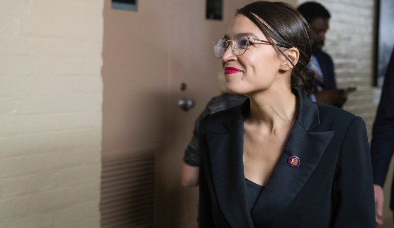 Rep. Alexandria Ocasio-Cortez, D-N.Y., smiles as House democrats arrive for a caucus meeting, Tuesday, Sept. 24, 2019 in Washington.