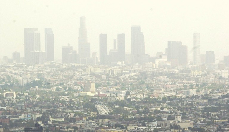 The Los Angeles skyline obscured by a heavy layer of smog and fog. (AP Photo/Jerome T. Nakagawa)