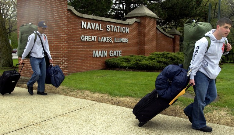 Seamen Jose Lopez, 18, left, from Ponce, Puerto Rico, and Brian Bitar, 19, from Miami, Fla., look for a cab outside the main gate of Great Lakes Naval Station after completing basic training and hospital corpsman school in Great Lakes, Ill., Friday, May 13, 2005.