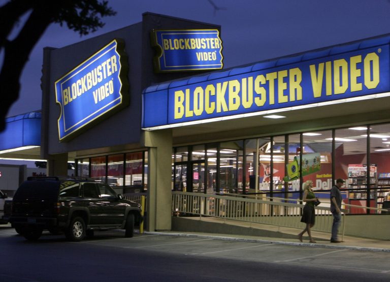 **FILE** Customers enter a Blockbuster video store in Dallas in this July 23, 2006 file photo.  Video rental chain Blockbuster Inc. said Wednesday, Aug. 8, 2007 it is buying the digital movie download service Movielink, giving it the online foothold it has long sought to compete with rival Netflix Inc.