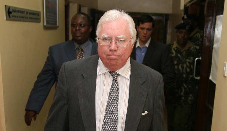 Jerome Corsi walks down a corridor in Nairobi, Kenya.
