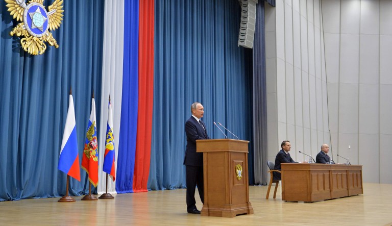 Russian President Vladimir Putin, left, speaks during a visit to Russian Foreign Intelligence Service (SVR) in Moscow, Russia