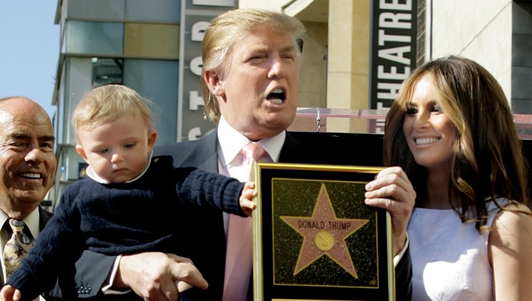 Donald Trump, billionaire developer and producer of NBC's "The Apprentice," with his wife, Melania, and their son, Barron, pose for a photo after he was given a star on the Hollywood Walk of Fame in Los Angeles.