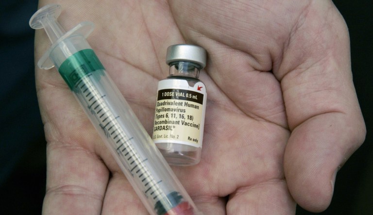 A doctor holds a vial of the human papillomavirus vaccine Gardasil in Chicago.