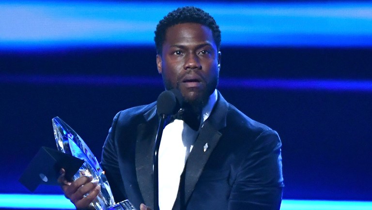Kevin Hart accepts the award for favorite comedic movie actor at the People's Choice Awards.