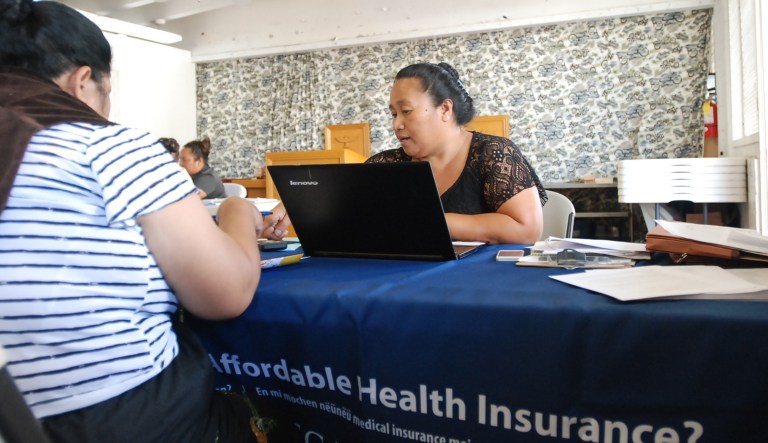 Cinder Sonis, right, an advocate with Legal Aid Society of Hawaii, helped a customer enroll in an Affordable Care Act health insurance plan on Monday, Jan. 30, 2017 in Honolulu. Faced with uncertainty about the federal health care law, Hawaii lawmakers are introducing bills to bring what they believe are the best parts of the Affordable Care Act into state law.