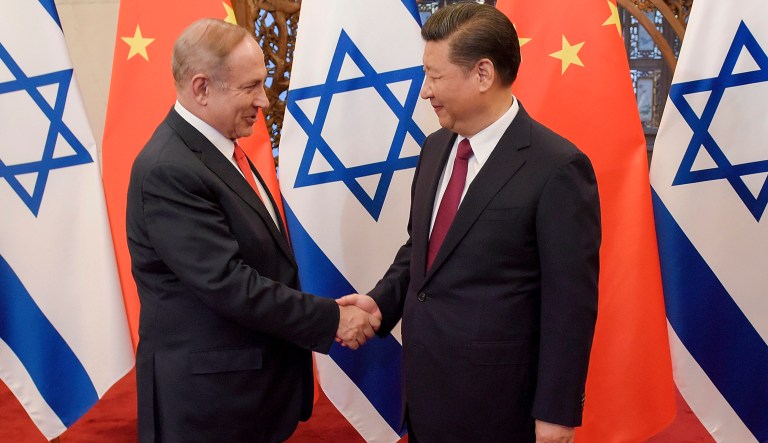 Israeli Prime Minister Benjamin Netanyahu, left, is greeted by Chinese President Xi Jinping ahead of their talks at Diaoyutai State Guesthouse Tuesday, March 21, 2017 in Beijing, China.