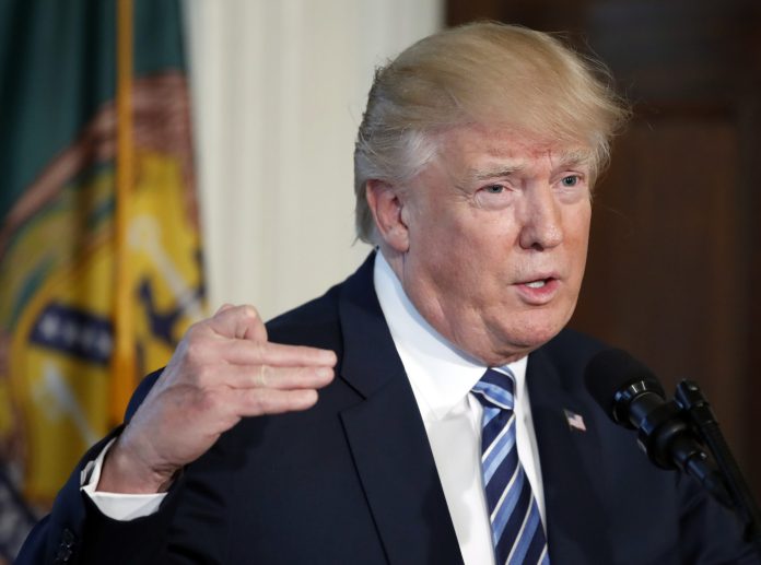 President Donald Trump speaks at the Treasury Department, Friday, April 21, 2017, in Washington.