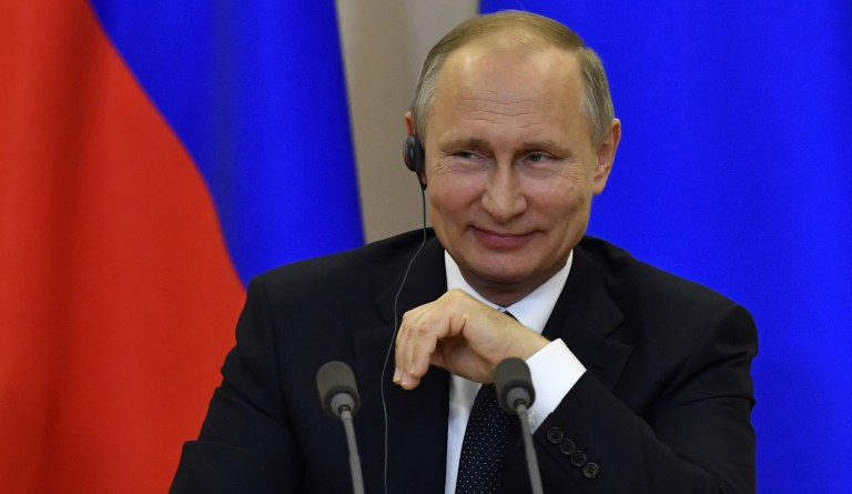 Russian President Vladimir Putin visits the Lifegiving Trinity Church in Moscow, Russia, Wednesday, Sept. 10, 2014. President Vladimir Putin said Wednesday that Russia will develop an array of new nuclear and conventional weapons to counter recent moves by the U.S. and NATO. (AP Photo/RIA-Novosti, Alexei Druzhinin, Presidential Press Service)