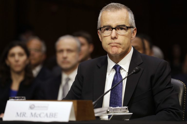 In this 2017 photo, former FBI Deputy Director Andrew McCabe listens on Capitol Hill in Washington.