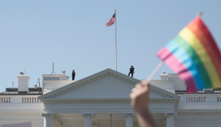 Equality March for Unity and Pride participants march past the White House in Washington, Sunday, June 11, 2017.