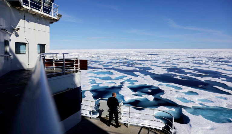 In this  July 22, 2017, file photo, Canadian Coast Guard Capt. Victor Gronmyr looks out over the ice covering the Victoria Strait as the Finnish icebreaker MSV Nordica traverses the Northwest Passage through the Canadian Arctic Archipelago.