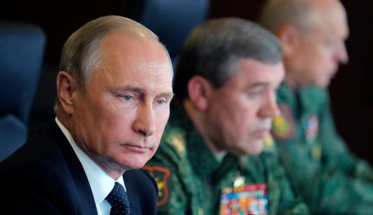 Russian President Vladimir Putin, left, and Chief of the General Staff of the Russian Armed Forces Valery Gerasimov, second right, watch a military exercise at a training ground at the Luzhsky Range, near St. Petersburg, Russia, Monday, Sept. 18, 2017. The Zapad (West) 2017 maneuvers have caused concern among some NATO members neighboring Russia, who have criticized a lack of transparency about the exercises and questioned Moscow's real intentions. (Mikhail Klimentyev, Sputnik, Kremlin Pool Photo via AP)
