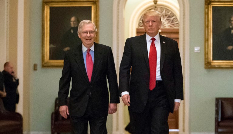 President Trump, escorted by Senate Majority Leader Mitch McConnell (pictured left), R-Ky., arrives on Capitol Hill.