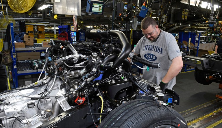 FILE- In this Oct. 27, 2017, file photo, workers assemble Ford trucks at the Ford Kentucky Truck Plant in Louisville, Ky. On Friday, March 16, 2018, the Federal Reserve reports on U.S. industrial production for February.