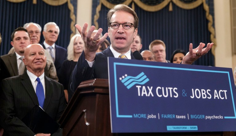 Rep. Peter Roskam, R-Ill., chairman of the House Ways and Means Subcommittee on Tax Policy, joined at left by Ways and Means Chairman Kevin Brady, R-Texas, describes the GOP's far-reaching tax overhaul, the first major revamp of the tax system in three decades, on Capitol Hill in Washington, Thursday, Nov. 2, 2017.