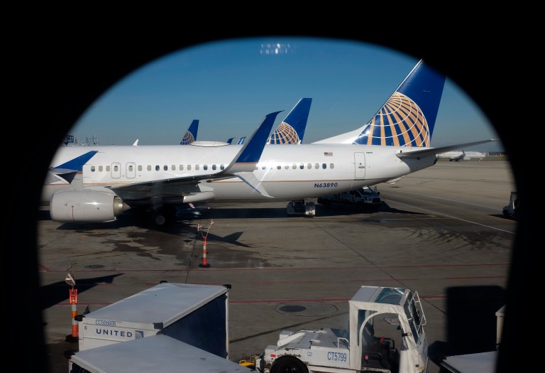 United Airlines planes are parked at a terminal at O'Hare International Airport in Chicago. 