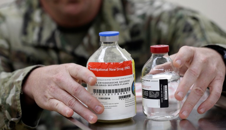 In this Wednesday, Nov. 8, 2017 photo, Army Col. Shawn Kane displays the components of freeze-dried plasma at Fort Bragg, N.C. All of the U.S. military's special operations fighters sent off to warzones and raids now have the essential addition to their first-aid kits. The plasma helps clot blood and can prevent badly wounded troops from bleeding to death on the battlefield. 