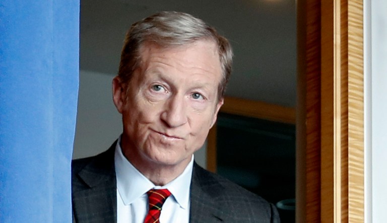 Billionaire environmental activist Tom Steyer arrives to speak during a news conference.