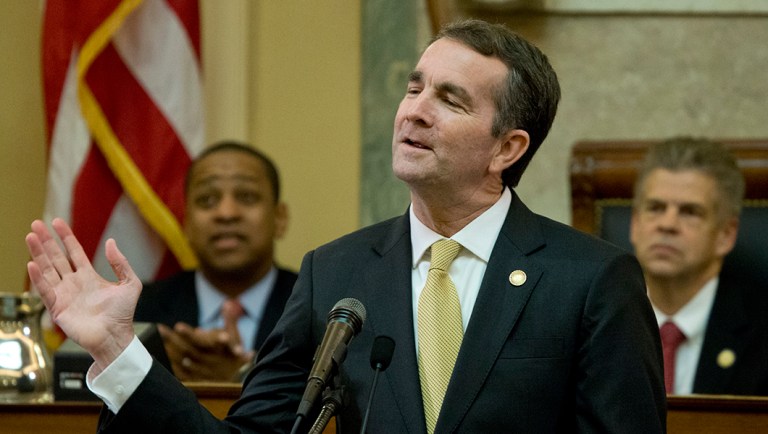 Virginia Gov. Ralph Northam gestures as he delivers his State of the Commonwealth address before a joint session of the Virginia General Assembly as Lt. gov. Justin Fairfax, left, and House Speaker Kirk cox, R-Colonial Heights, right, listen at the Capitol in Richmond, Va., Monday, Jan. 15, 2018. 